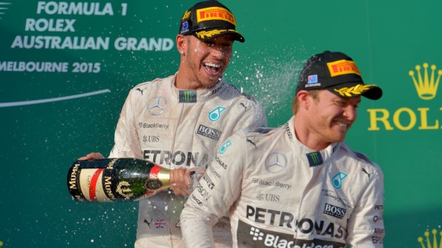 Hamilton and Nico Rosberg spray the bubbly on the podium.