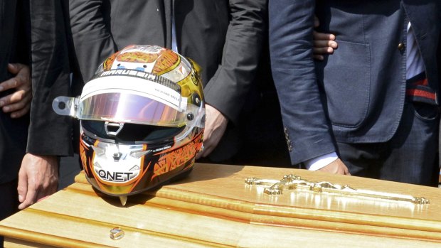 Tragedy: The helmet of late Marussia Formula One driver Jules Bianchi is placed on his coffin at his funeral in July, 2015.