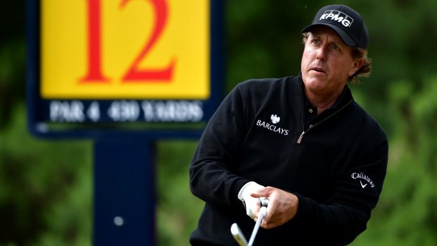 Phil Mickelson hits his tee shot on the 12th during the final round.