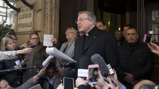 Cardinal Pell reads a statement after meeting victims of abuse in Rome last month. 
