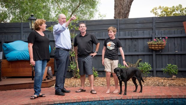 Planning Minister Richard Wynne (middle) with the McMahon family - Claire, Steve and son Joseph - in Mentone.