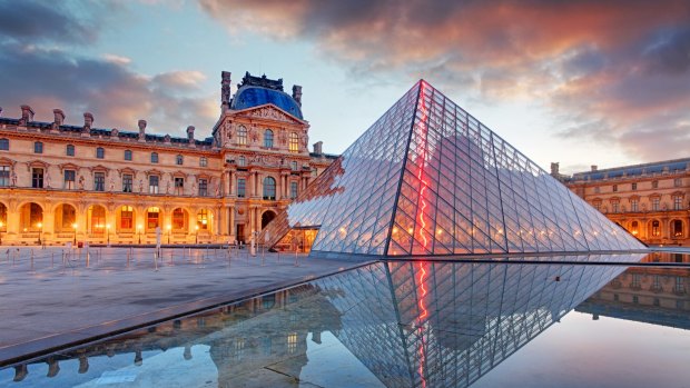 The Louvre Museum and the Pyramid at sunrise.