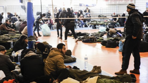 Asylum seekers at an ad hoc first aid centre after arriving in Italy aboard the Moldovan-flagged ship Blue Sky M this week. It was rapidly followed by another ship of asylum-seekers. 