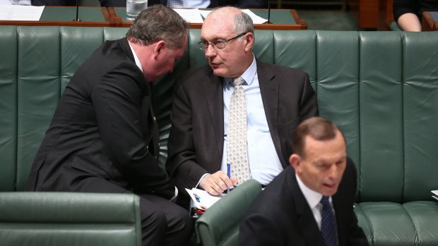 Agriculture Minister Barnaby Joyce and Deputy Prime Minister Warren Truss talk tactics as Prime Minister Tony Abbott concentrates on parliamentary business.