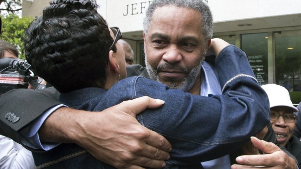 Pat Turner, left, hugs Anthony Ray Hinton as he is finally free from prison.