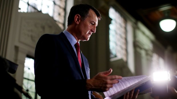 Lord Mayor Graham Quirk peruses the 2015-16 Brisbane City Council Budget before handing it down on Wednesday.