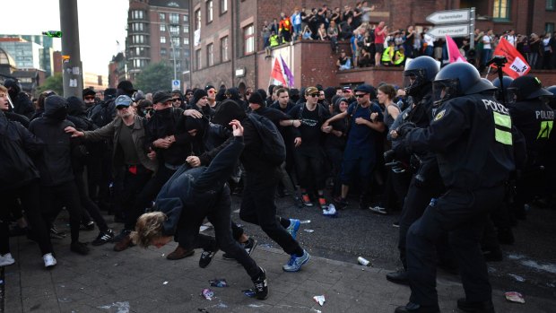 Police forces clash with protesters during a march on Friday in Hamburg.