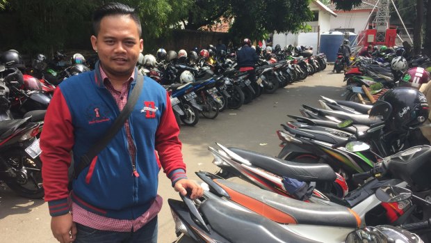 Imas, who is participating in a free government program to transport motorcycles to people's home villages over the Idul Fitri holiday period.