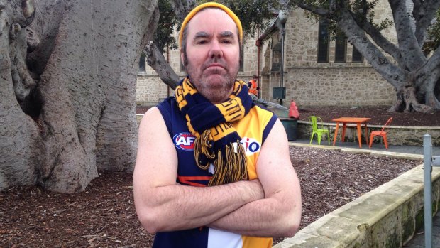 Blue-and-gold steel: Brendan Foster proudly sports Eagles colours deep in Freo territory.