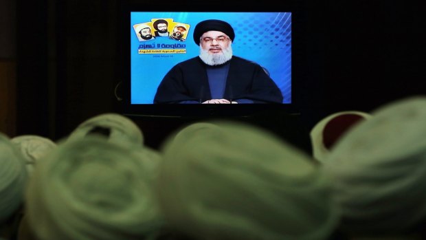 Shiite and Sunni clerics listen to Hezbollah leader Sayyed Hassan Nasrallah, via video link, during a ceremony to honour fallen Hezbollah leaders, in Beirut, Lebanon, on Tuesday.