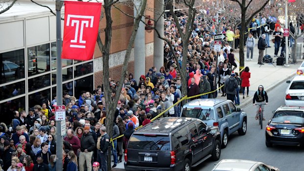 People wait in line to see Democratic presidential hopeful Bernie Sanders at Temple University in Philadelphia.