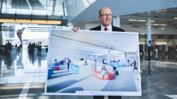 Canberra Airport managing director Stephen Byron with plans for the new international lounge.