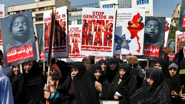 Iranian worshippers attend a protest rally after the Friday prayers as they hold placards in support of muslim Rohingya in Tehran, Iran, on September 8.