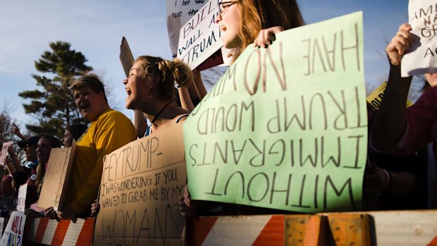 Protesters demonstrate ahead of a campaign stop by Donald Trump at the University of Wisconsin.