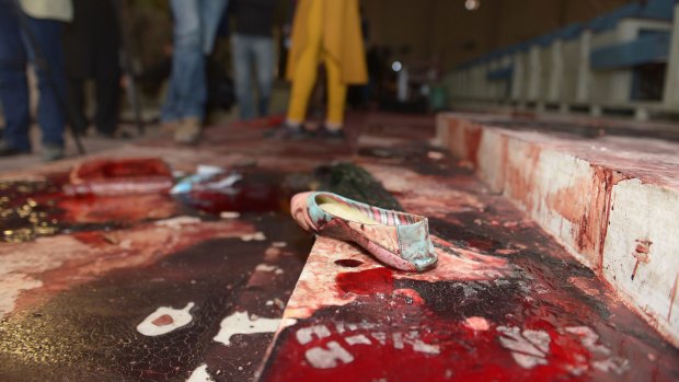 A girl's shoe lies on the floor in the bloodied ceremony hall where many students were executed.