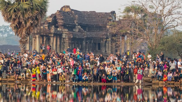 The dawn scrum at Angkor Wat, Cambodia, features in the documentary The Last Tourist.