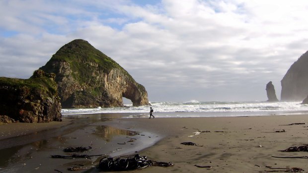 Chiloe's west coast is a place of empty beaches surrounded by rugged coastal forest and mountains.