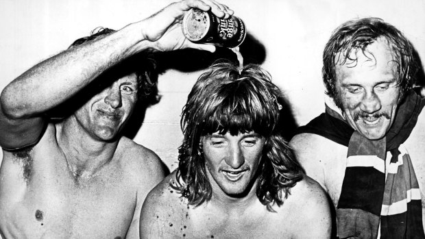 Code-hopper: Mark Harris celebrates Easts’ 1974 grand final win with Ron Coote and Russell Fairfax.