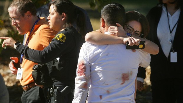 A couple embrace following the San Bernardino shooting in early December.
