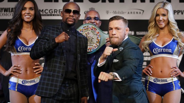 Ready to rumble: Floyd Mayweather jnr and Conor McGregor with the "Money Belt" in the background.