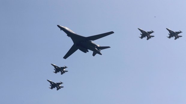 A US B-1 bomber flanked by fighter jets during a show of force over the Korean Peninsula in September 2016.