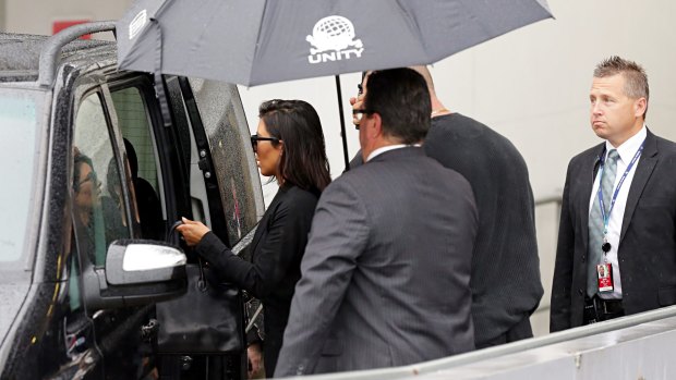 Hello Australia: Kim Kardashian is escorted to a waiting car on November 16. 
