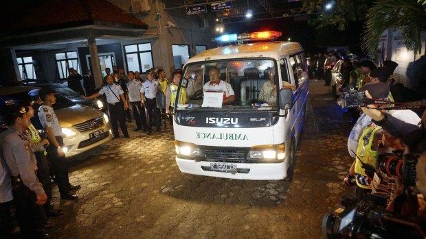 An ambulance transports the body of Nigerian prisoner Daniel Enemuo from Indonesia's Nusa Kambangan prison, where five people were killed by firing squad on Sunday.