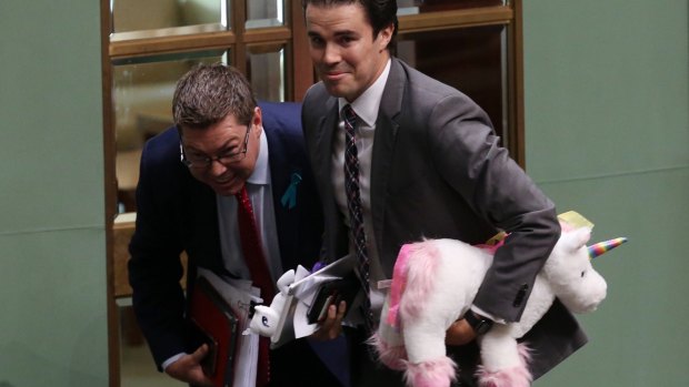 Labor MPs Pat Conroy and Tim Watts bow to the Speaker after being ejected from the House of Reprentatives for displaying unicorn props.