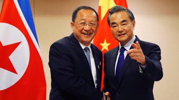 North Korean Foreign Minister Ri Yong Ho and his Chinese counterpart Wang Yi before their bilateral meeting at the ASEAN foreign ministers' meeting in Manila.