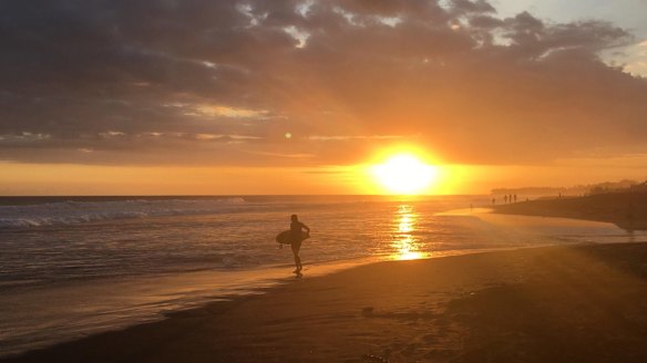 The sun slips beneath the waves.