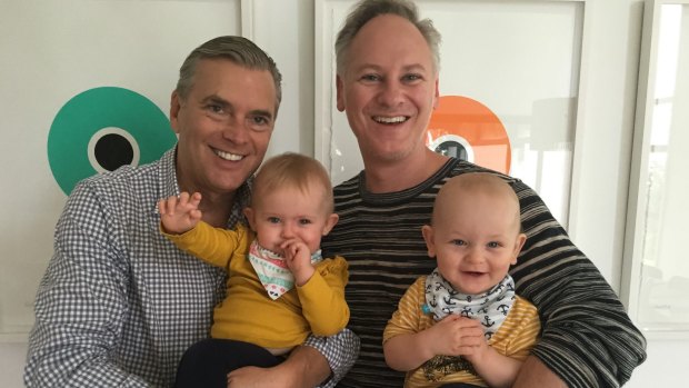 Dr Shane Woods and his partner Scott Koopman with their twins, born via surrogate.