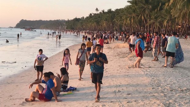 Visitors on the beach at sunset on Boracay last Friday after the island reopened to tourists.