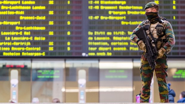 A Belgian soldier patrols in the main train station in the centre of Brussels on Sunday.