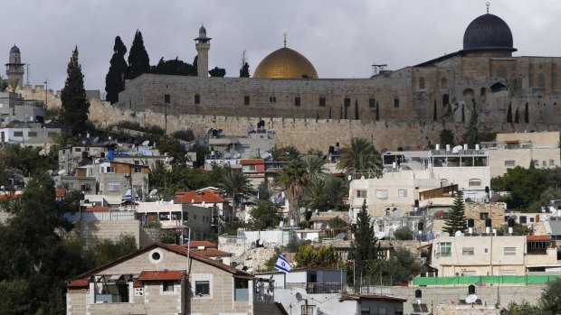 Flashpoint: The golden Dome of the Rock and to its right the dome of the al-Aqsa Mosque are seen from the occupied East Jerusalem neighbourhood of Silwan.