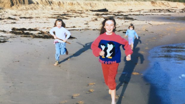 Julia Gardiner (left), Mary Gardiner (centre) and Stephanie Gardiner (right) run on Putty Beach, on the NSW Central Coast, in about 1990.