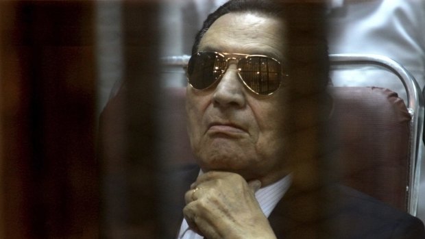 Ousted Egyptian President Hosni Mubarak attends a hearing in his retrial over charges of failing to stop killings of protesters during the 2011 uprising that led to his downfall.