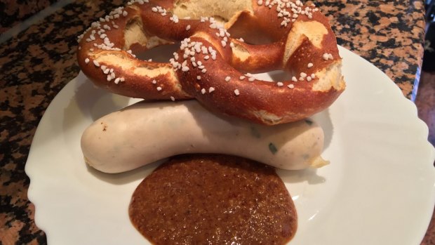 A bread pretzel, weisswurst sausage and honey mustard, served up by a Munich butcher.