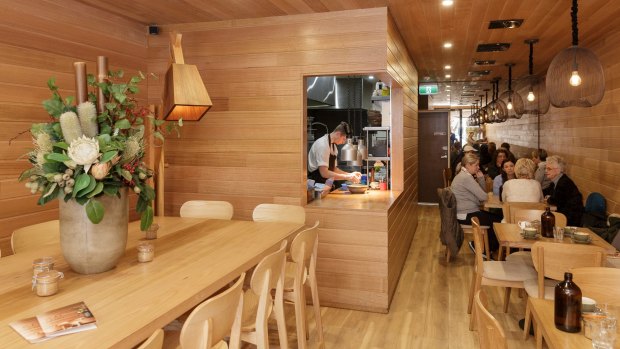 The cafe interior features Tasmanian oak-lined walls.