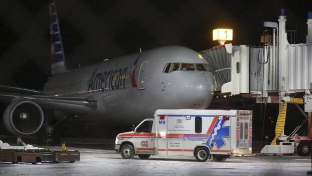 An ambulance departs St John's International Airport on Sunday in St John's, Newfoundland. Seven people were taken to hospital after an American Airlines plane from Miami to Milan made an emergency landing after the jet briefly encountered severe turbulence. 