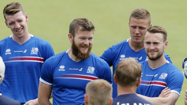 Iceland players listen to the coach. The team is contemplating a fairytale ending following their 2-1 win over England.