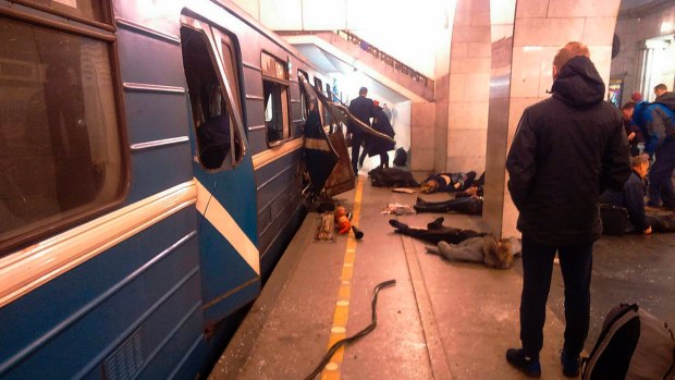 Blast victims lie near a subway train hit by a explosion at the Tekhnologichesky Institut subway station in St.Petersburg, Russia.