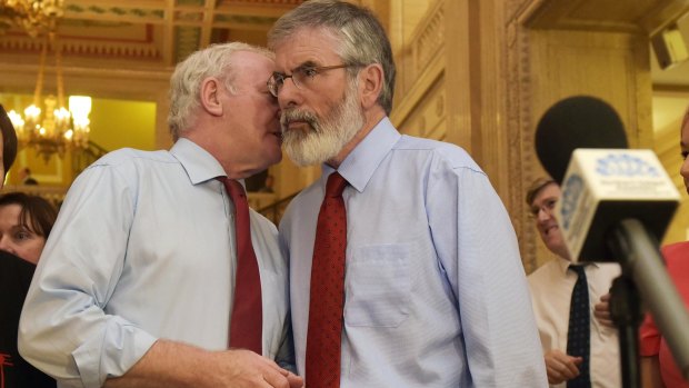Sinn Fein leaders Martin McGuinness (left) and Gerry Adams confer at Stormont in September, at the height of the political crisis over their allegedly continuing links to the IRA.