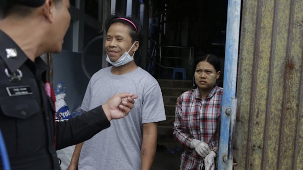 Tin Nyo Win, centre, smiles as he is reunited with his wife, Mi San, in Samut Sakhon, Thailand in November.