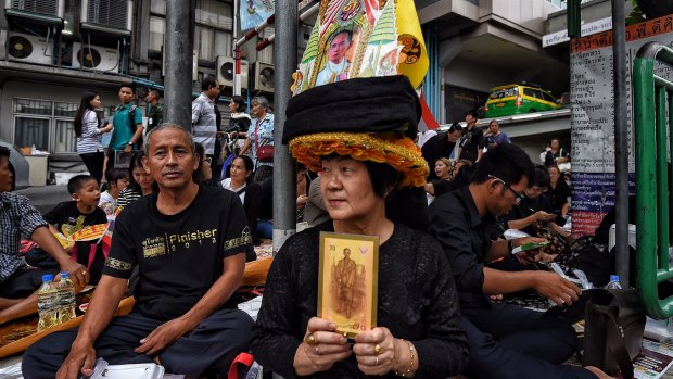 Crowds gather outside Siriraj Hospital in Bangkok on Friday following the King Bhumibol's death.