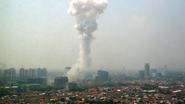 Smoke billows after a blast outside the Australian embassy in Jakarta on September 9, 2004.