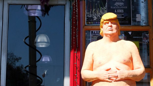 A statue of presidential hopeful Donald Trump is placed outside a shop in Los Angeles. 
