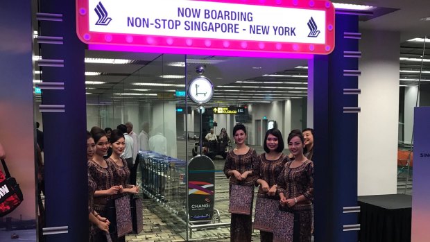 The famous Singapore Girls welcome passengers aboard the inaugural flight. 