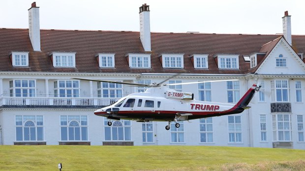 Trump lands at his golf course in Scotland.