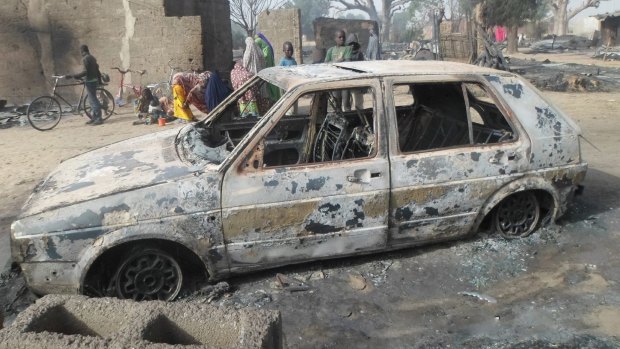 A survivor who sheltered in a tree says he watched Boko Haram extremists firebomb huts and listened to the screams of children as they were burnt to death near Maiduguri on Saturday.