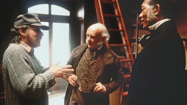 Spielberg with Anthony Hopkins, centre, and Morgan Freeman on the set of <i>Amistad</i>.